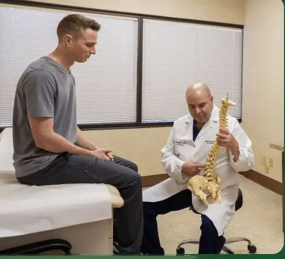 Spine specialist examining a patient
